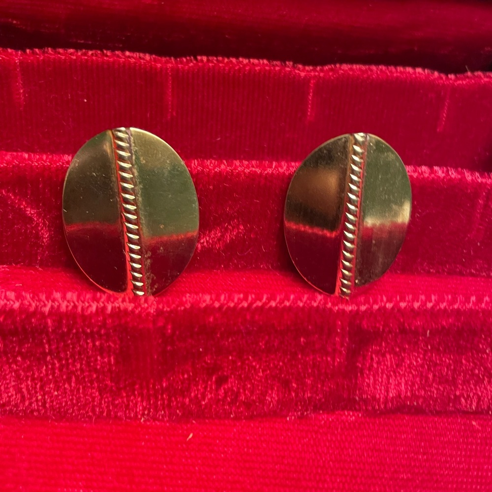 Large gold tone metallic earrings